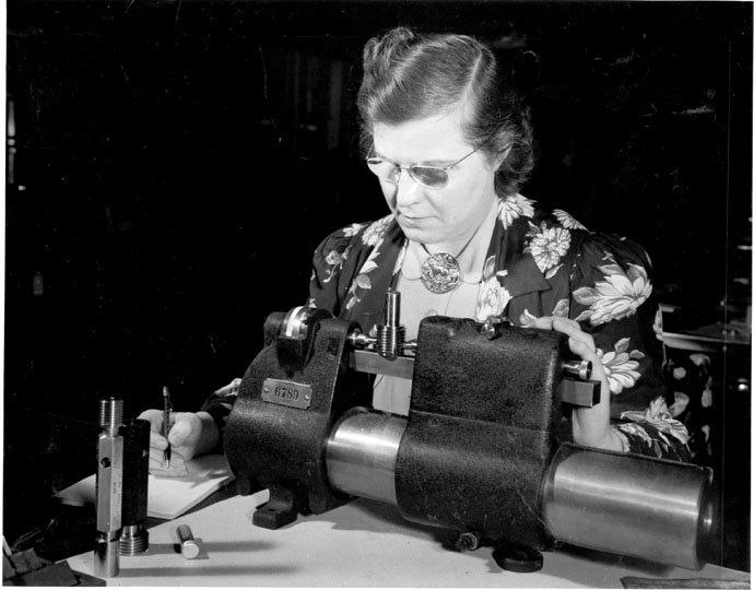 Mrs. Nellie Buker Checking Gages