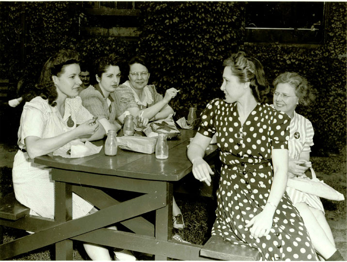 Women sitting at picnic table